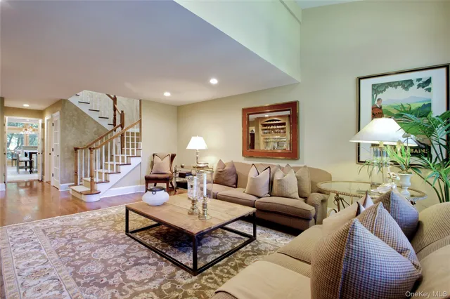a living room with furniture and a table