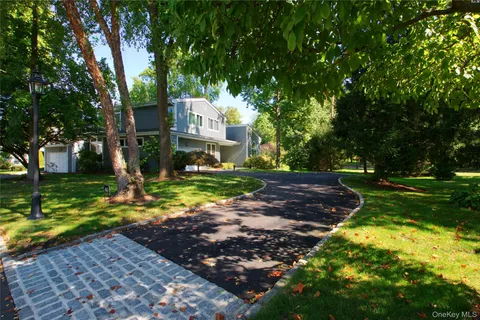 a view of a street with a building in the background