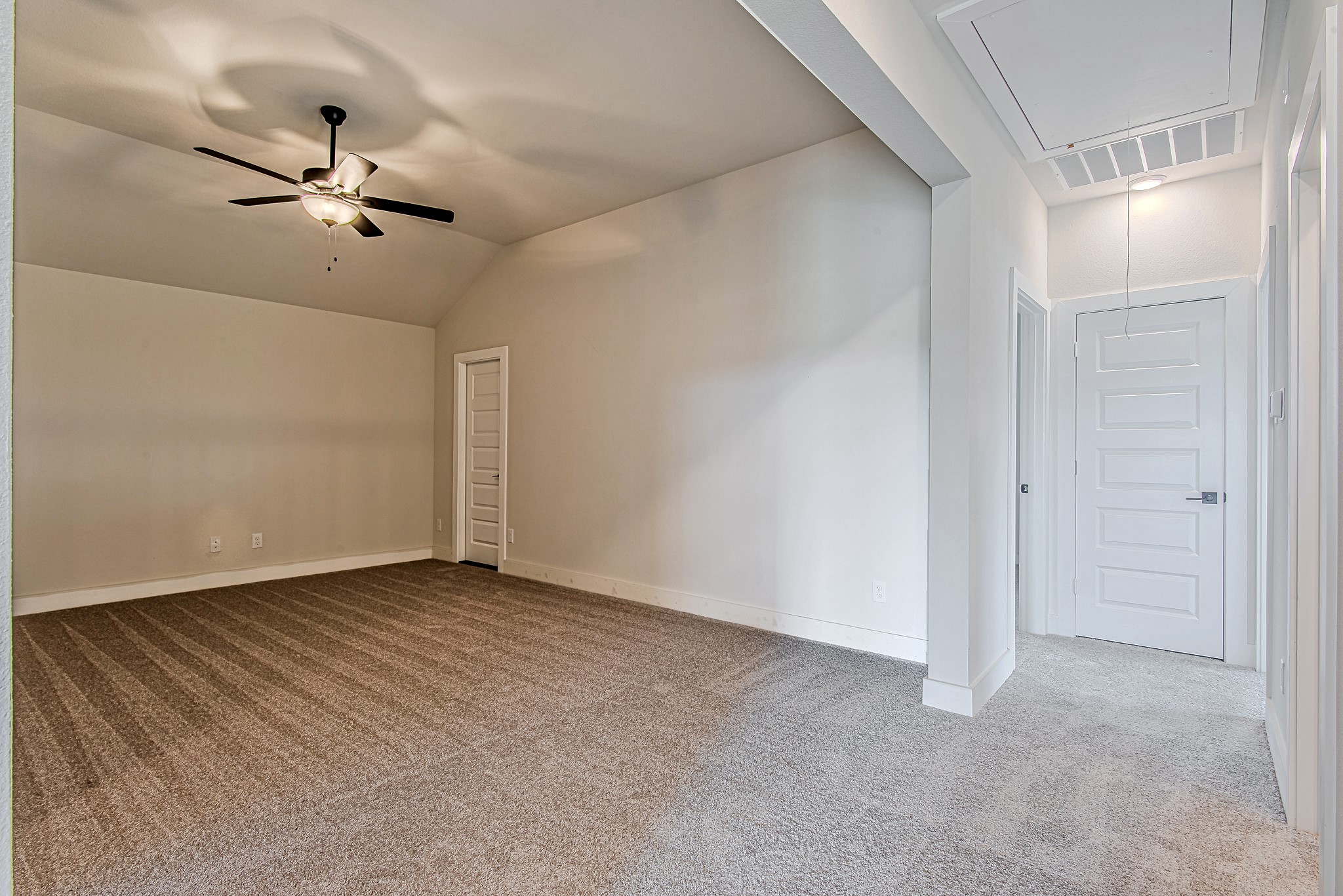 141 Peninsula Point Drive Montgomery, TX 77356 - Photo 33 of 47 Another angle of the game room/bonus area highlights the open-concept flow and sightlines to the hallway and stair landing.