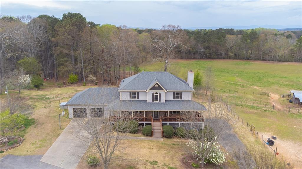 7720 Smith Farm Road Cumming, GA 30028 - Photo 1 of 1 a front view of a house with a yard