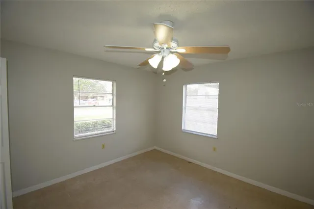a view of an empty room with a window