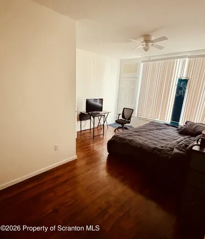 a bed sitting in a room next to a window