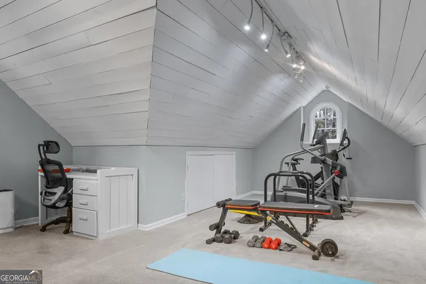 workspace with wooden floor and white walls
