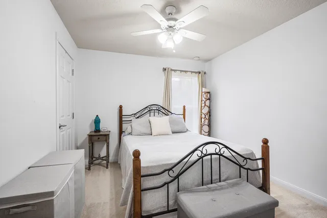 a bedroom with furniture and a chandelier
