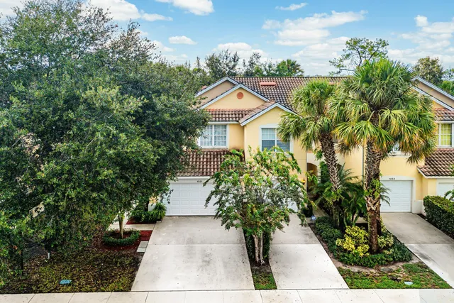 a house with trees in front of it