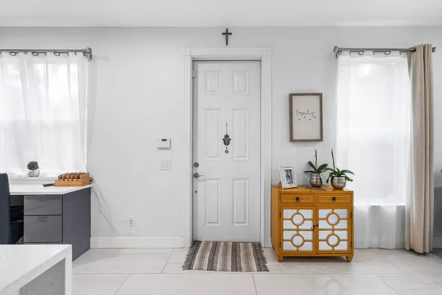 a dining room with furniture and window