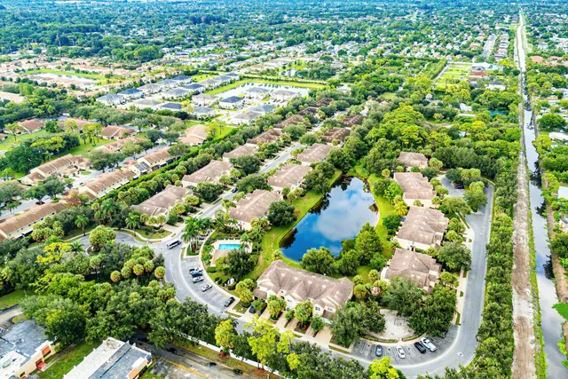 an aerial view of house with yard swimming pool and outdoor seating