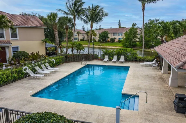 a backyard of a house with a swing