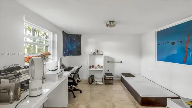 a room with gym equipment and a large window