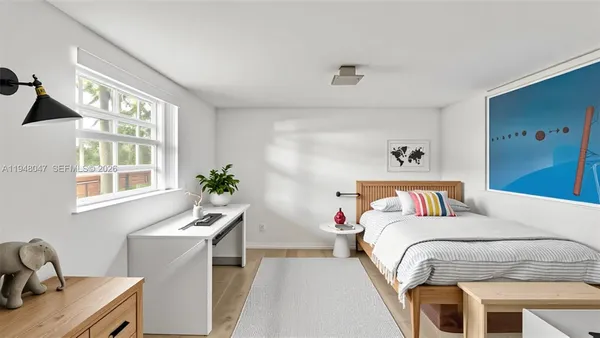 a bedroom with a bed and a desk