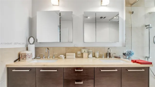 a room with a sink and cabinets