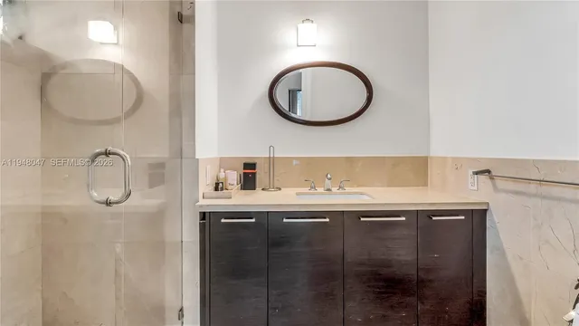 a bathroom with a sink and a mirror