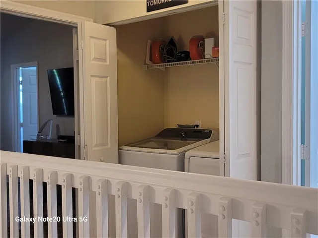 a view of a kitchen from a hallway