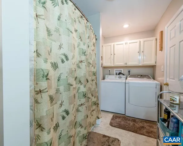 a view of a house with a yard and garage