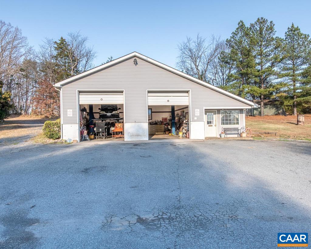 3483 West River Road Scottsville, VA 24590 - Photo 25 of 33 a view of a house with a yard and garage