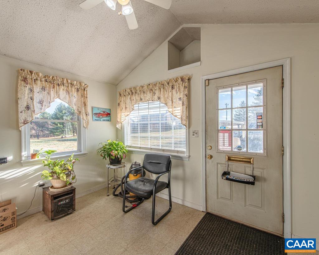 3483 West River Road Scottsville, VA 24590 - Photo 26 of 33 a living room with furniture and a window