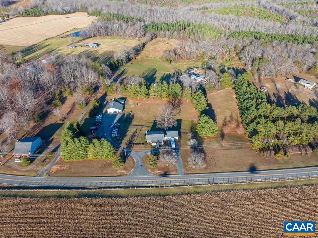 3483 West River Road Scottsville, VA 24590 - Photo 4 of 33 an aerial view of a house with a yard and lake view