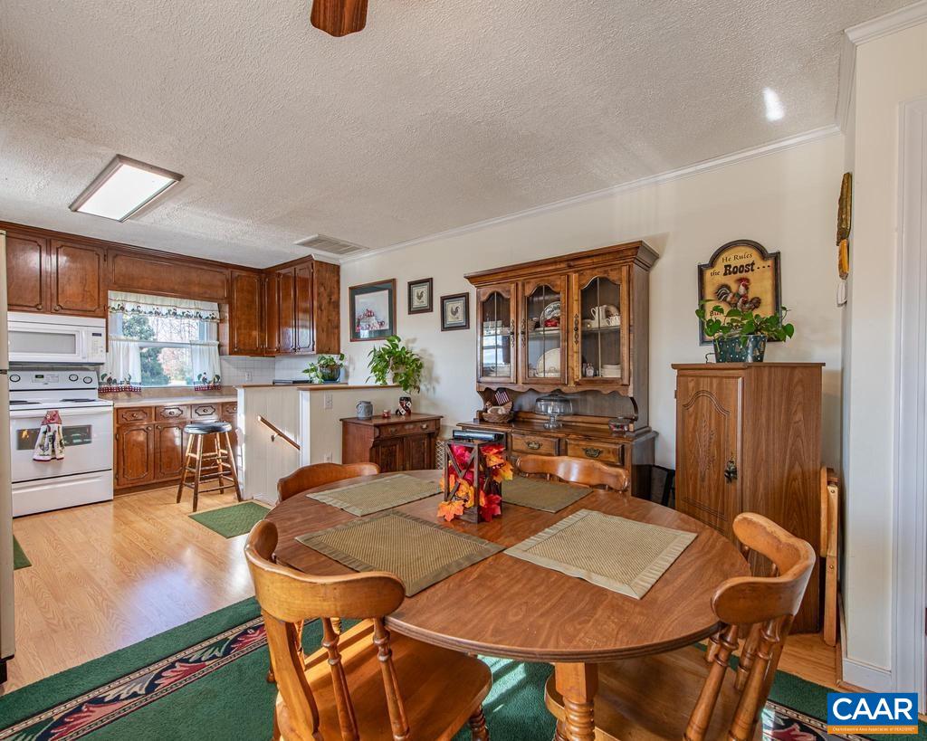 3483 West River Road Scottsville, VA 24590 - Photo 8 of 33 a view of a dining room with furniture and a window