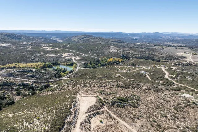 an aerial view of residential house and green space