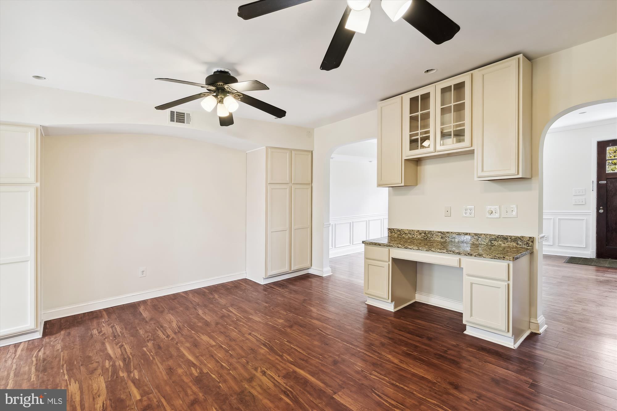 116 Murdock Road Baltimore, MD 21212 - Photo 11 of 42 a view of a livingroom with furniture wooden floor a ceiling fan and windows