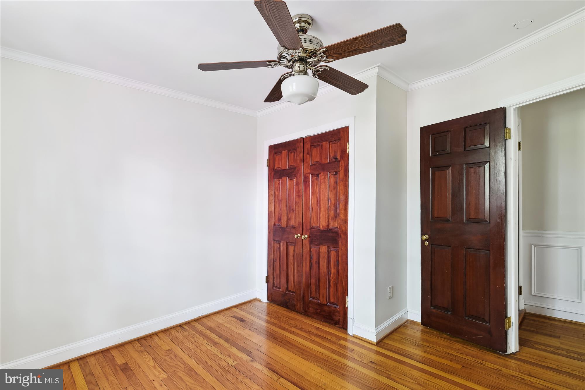 116 Murdock Road Baltimore, MD 21212 - Photo 20 of 42 an empty room with wooden floor closet and windows