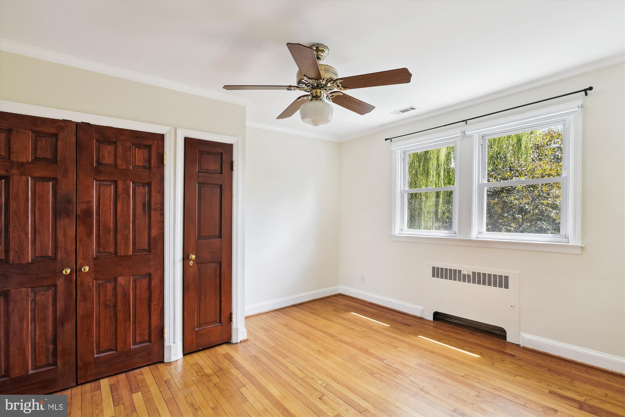 116 Murdock Road Baltimore, MD 21212 - Photo 21 of 42 an empty room with wooden floor closet and windows