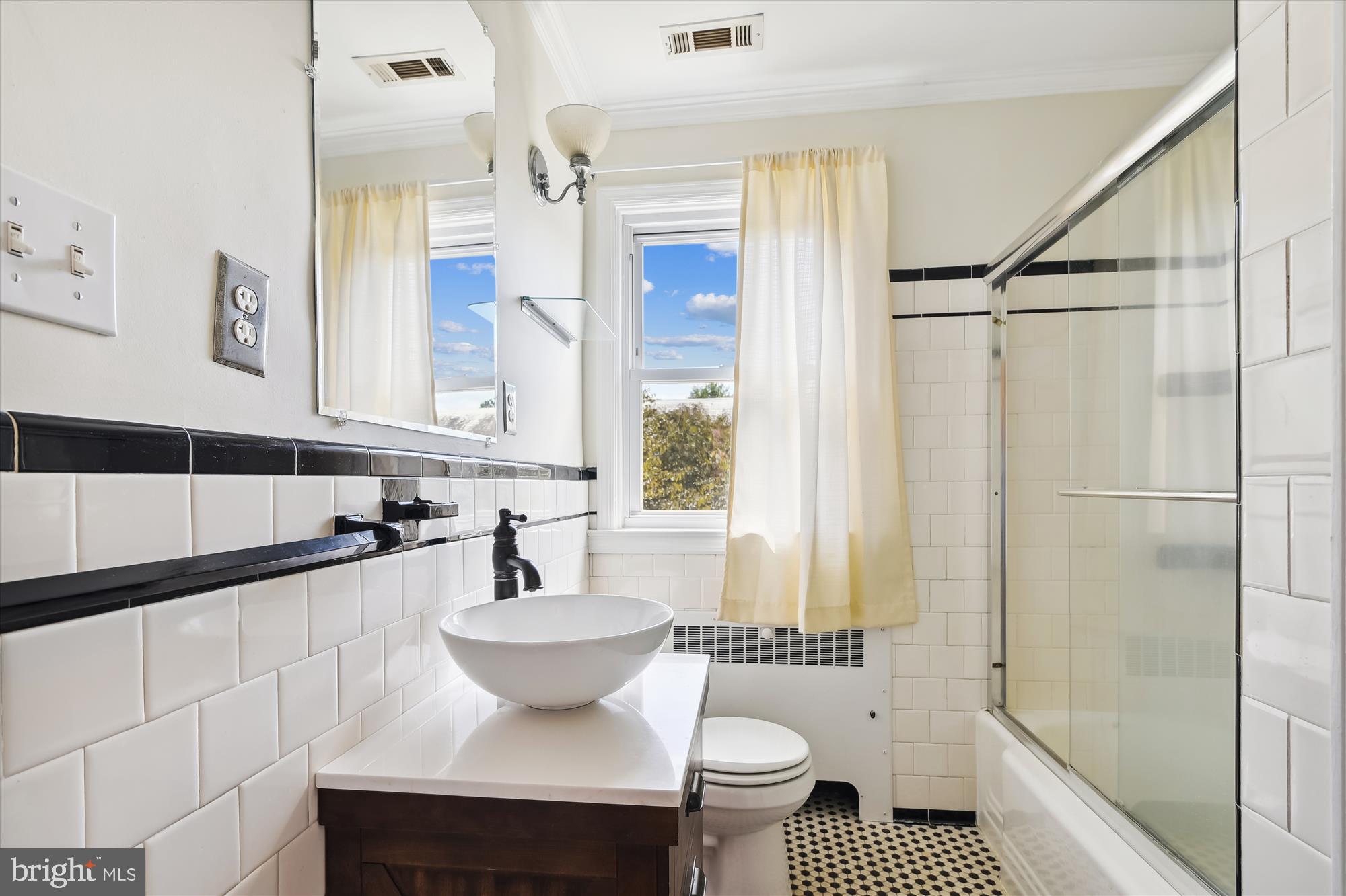 116 Murdock Road Baltimore, MD 21212 - Photo 22 of 42 a bathroom with a sink and a mirror