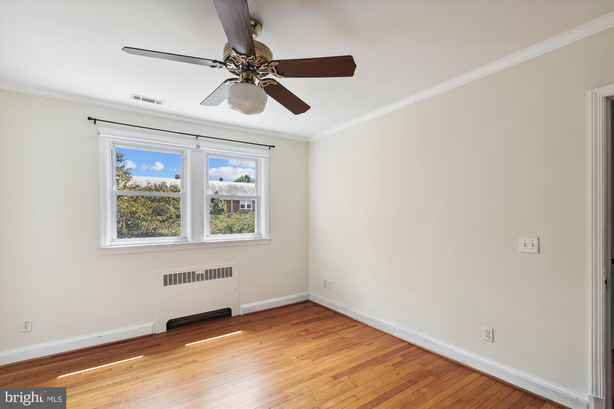 116 Murdock Road Baltimore, MD 21212 - Photo 25 of 42 a view of an empty room with a window and wooden floor