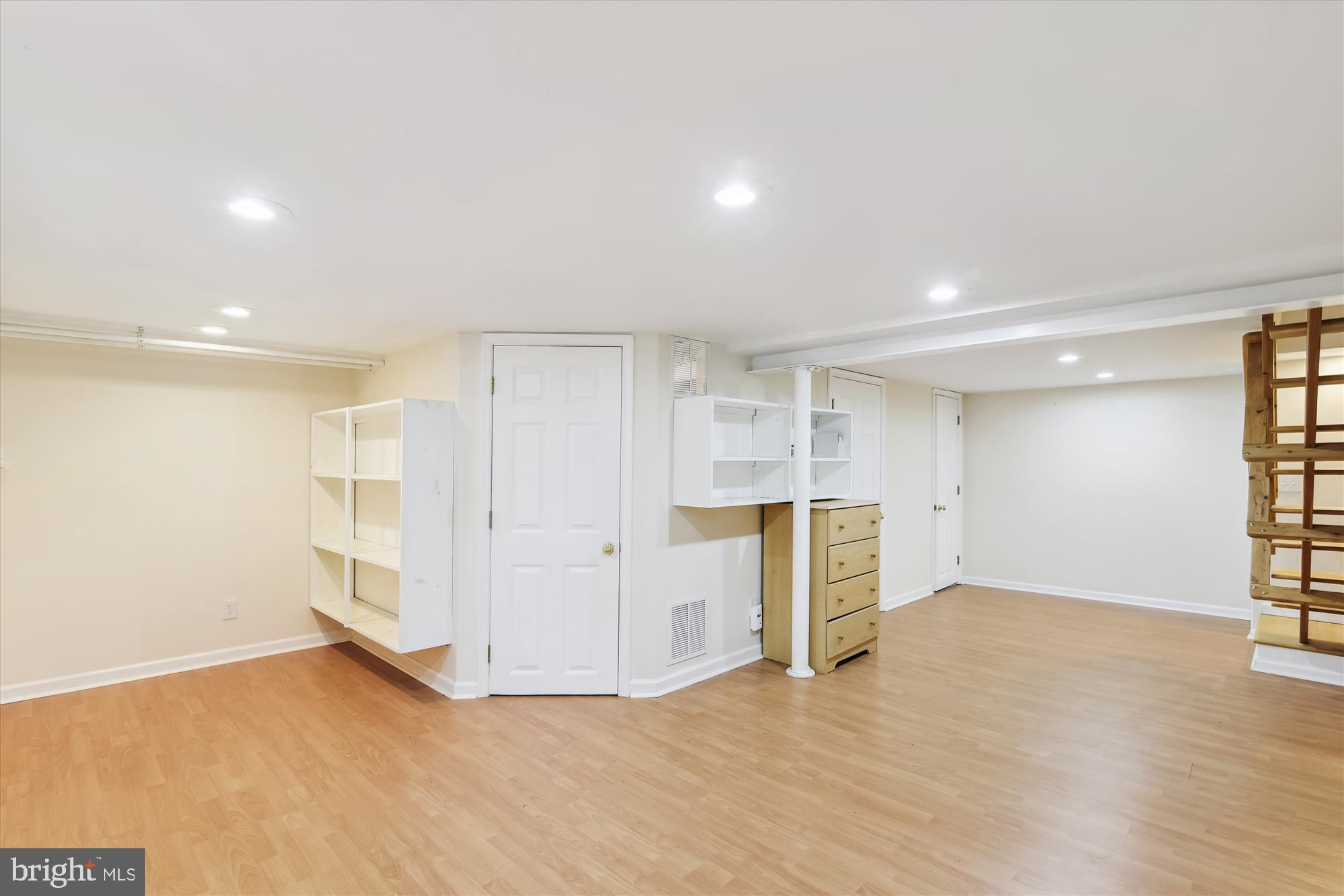116 Murdock Road Baltimore, MD 21212 - Photo 31 of 42 a view of an empty room with wooden floor and a window