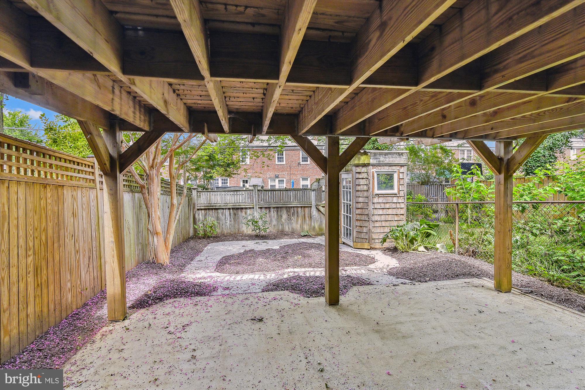 116 Murdock Road Baltimore, MD 21212 - Photo 39 of 42 a backyard with wooden fence and a porch