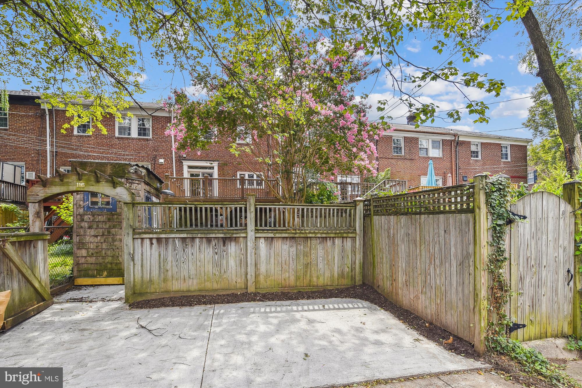 116 Murdock Road Baltimore, MD 21212 - Photo 42 of 42 a view of a house with a wooden fence and a tree
