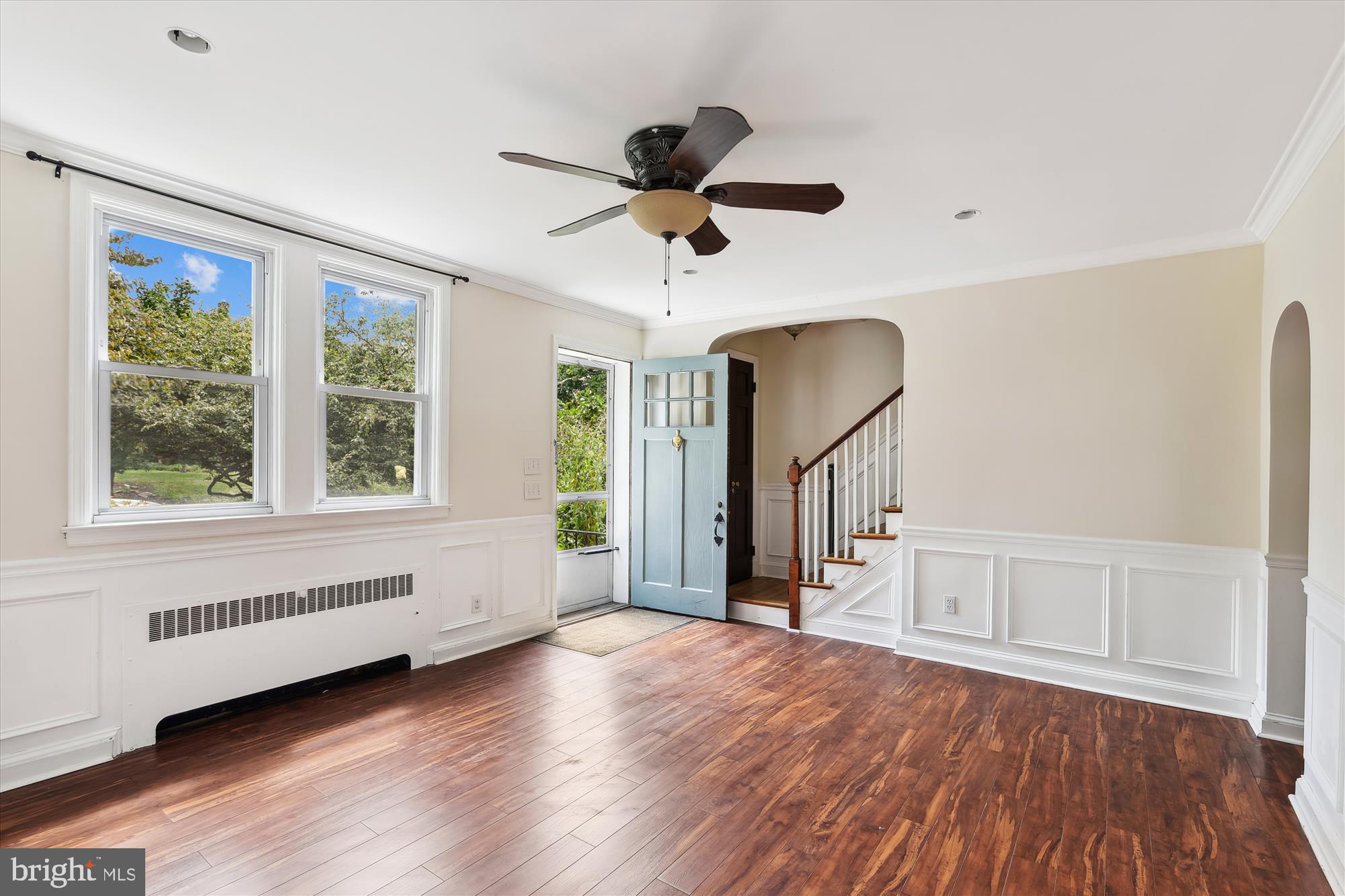 116 Murdock Road Baltimore, MD 21212 - Photo 5 of 42 a view of an empty room with a window and wooden floor