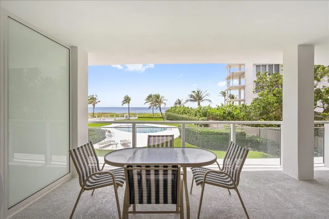 a view of a swimming pool with seating space