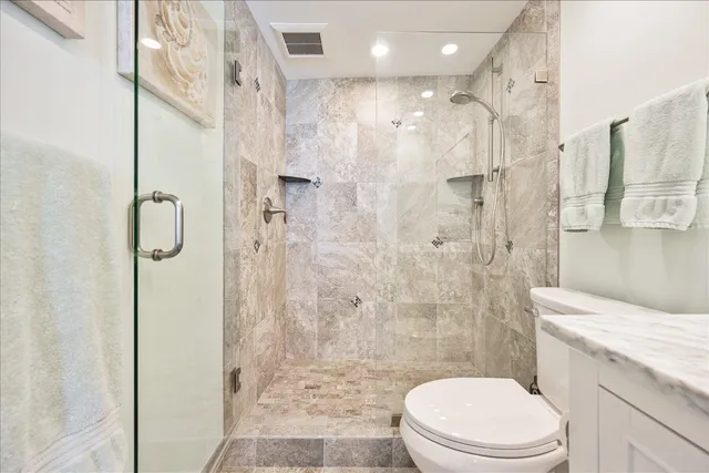 a kitchen with stainless steel appliances a stove sink microwave and cabinets