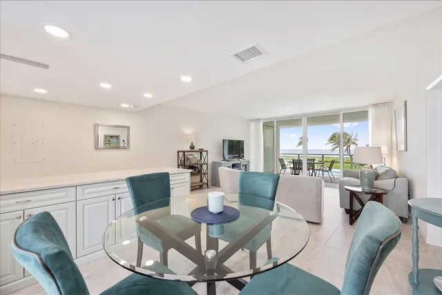 a kitchen with granite countertop a sink stove and microwave