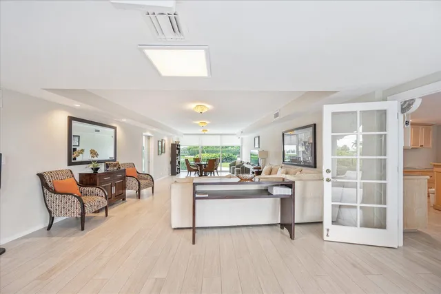 a living room with furniture a fireplace and a table