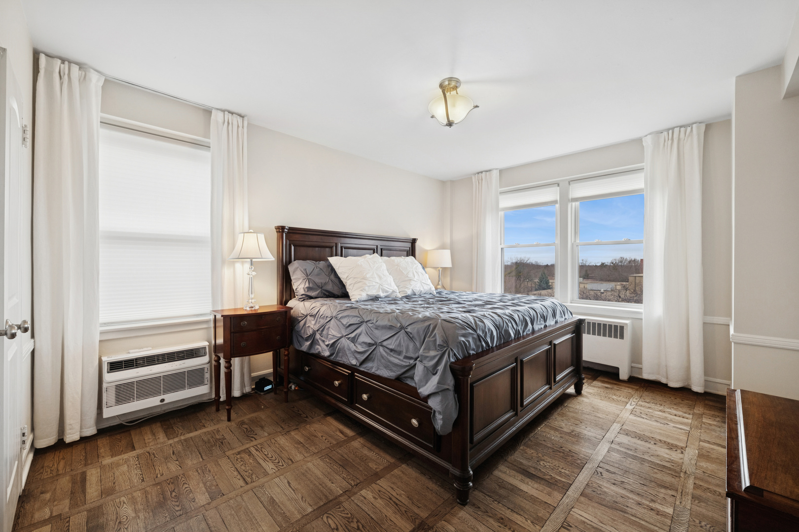 1585 Ridge Avenue, Unit 611 Evanston, IL 60201 - Photo 12 of 21 a bedroom with a bed and a window