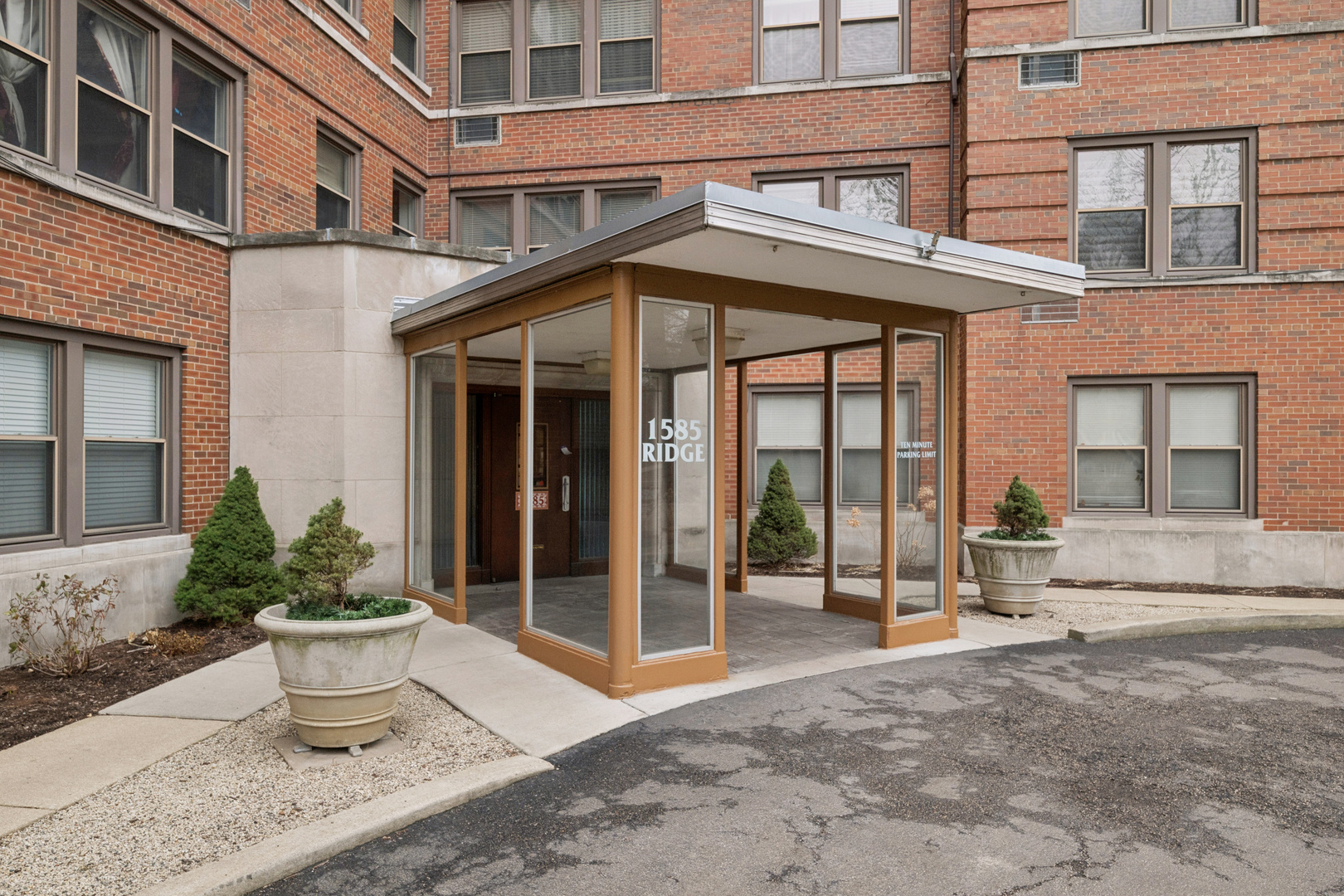 1585 Ridge Avenue, Unit 611 Evanston, IL 60201 - Photo 19 of 21 a view of a building with a potted plant and a window