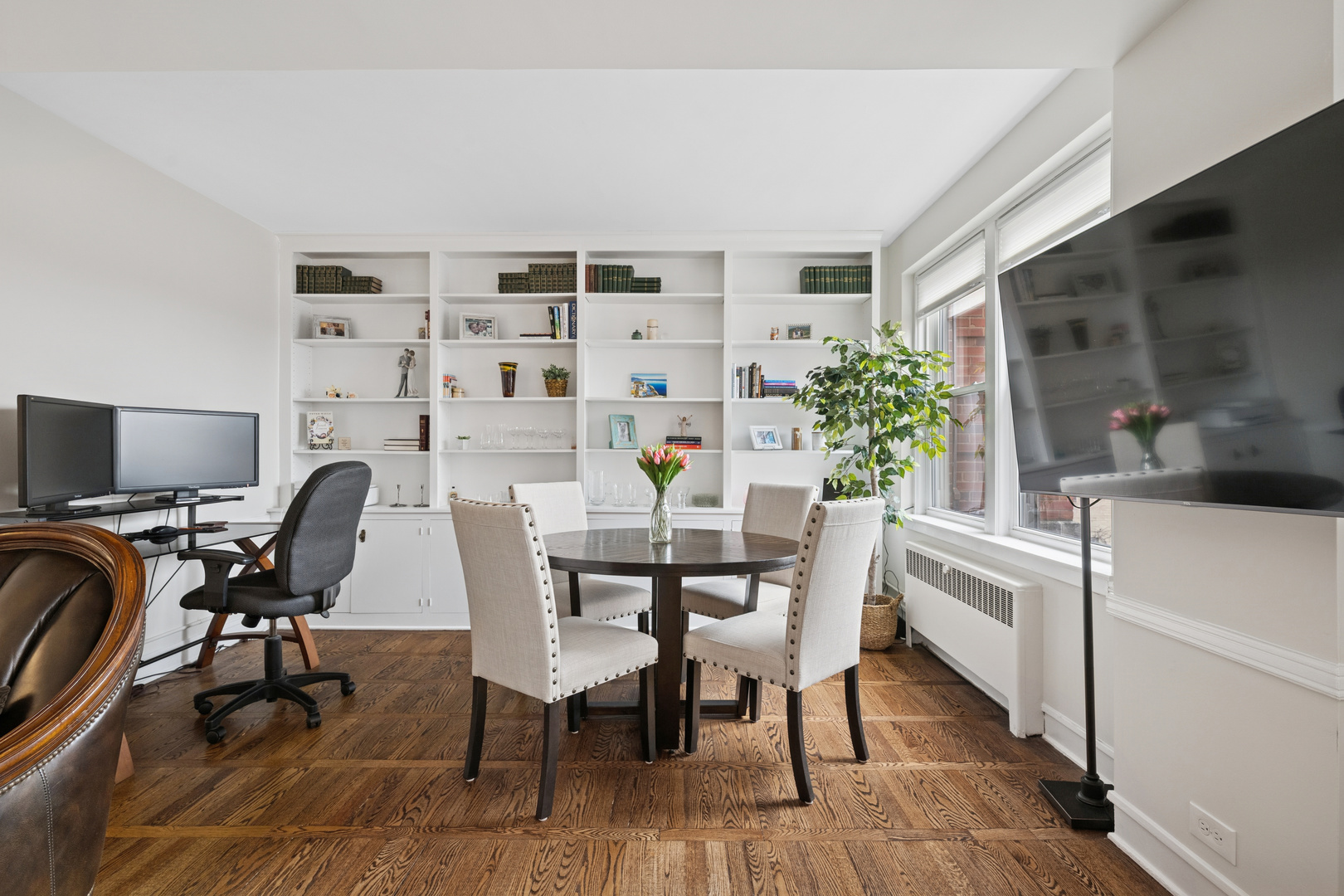 1585 Ridge Avenue, Unit 611 Evanston, IL 60201 - Photo 3 of 21 a view of a workspace with furniture and a potted plant