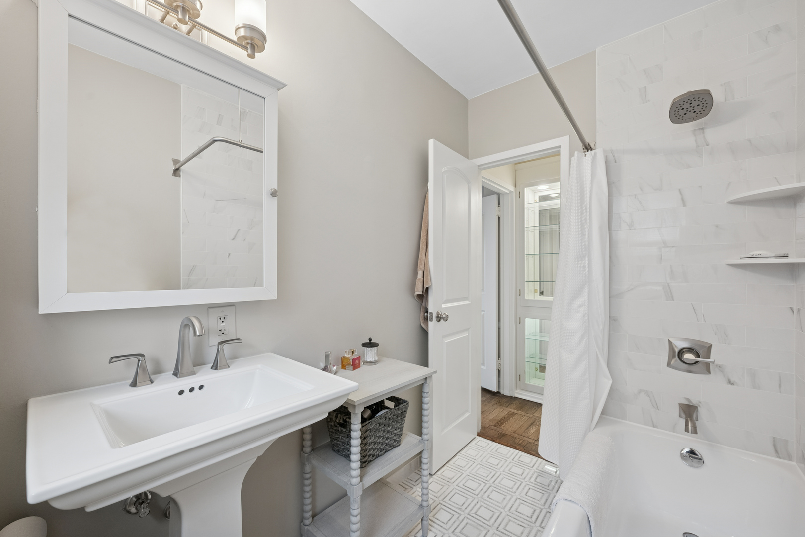 1585 Ridge Avenue, Unit 611 Evanston, IL 60201 - Photo 10 of 21 a bathroom with a tub sink and mirror