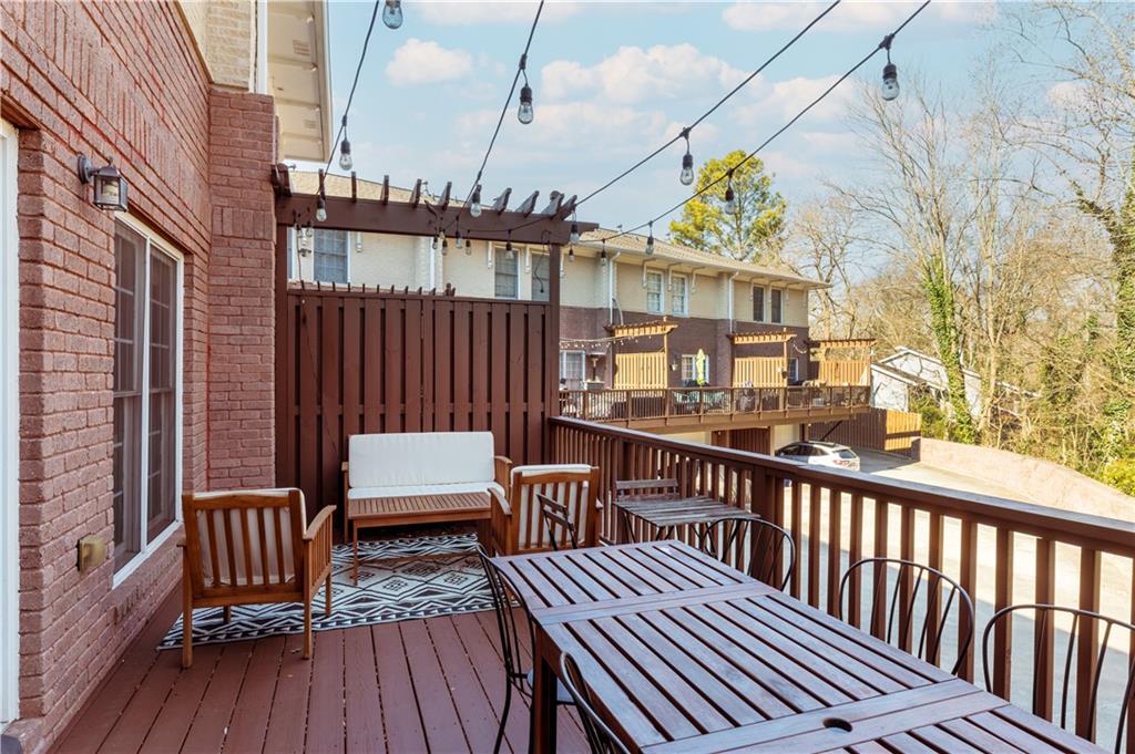 7 Chief Matthews Road, Unit 2B Decatur, GA 30030 - Photo 12 of 41 a view of a roof deck with wooden floor and fence