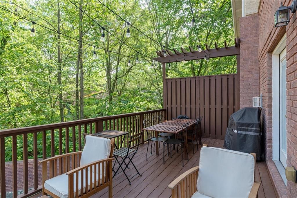 7 Chief Matthews Road, Unit 2B Decatur, GA 30030 - Photo 13 of 41 a view of a chair and table on the deck