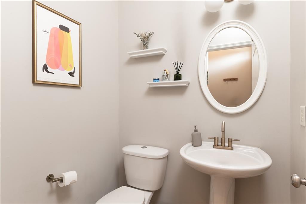 7 Chief Matthews Road, Unit 2B Decatur, GA 30030 - Photo 14 of 41 a bathroom with a toilet sink and mirror
