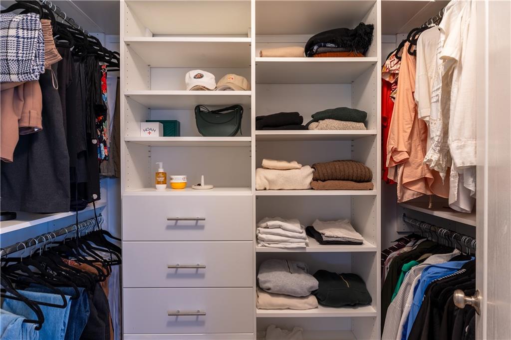 7 Chief Matthews Road, Unit 2B Decatur, GA 30030 - Photo 17 of 41 a view of walk in closet with clothes and shoes