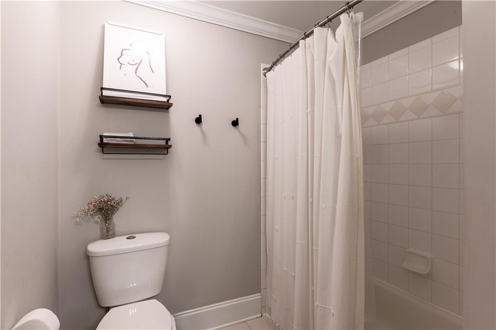 7 Chief Matthews Road, Unit 2B Decatur, GA 30030 - Photo 19 of 41 a bathroom with a toilet a sink and a shower