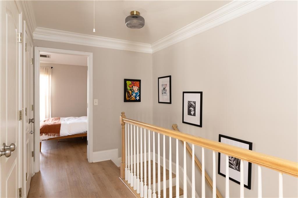 7 Chief Matthews Road, Unit 2B Decatur, GA 30030 - Photo 20 of 41 a view of a hallway with bedroom and wooden floor