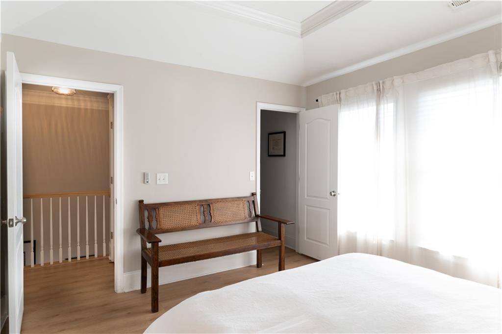 7 Chief Matthews Road, Unit 2B Decatur, GA 30030 - Photo 24 of 41 a bedroom with a bed and a window