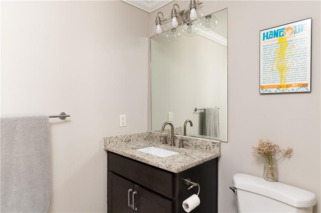 7 Chief Matthews Road, Unit 2B Decatur, GA 30030 - Photo 25 of 41 a bathroom with a granite countertop sink and a mirror