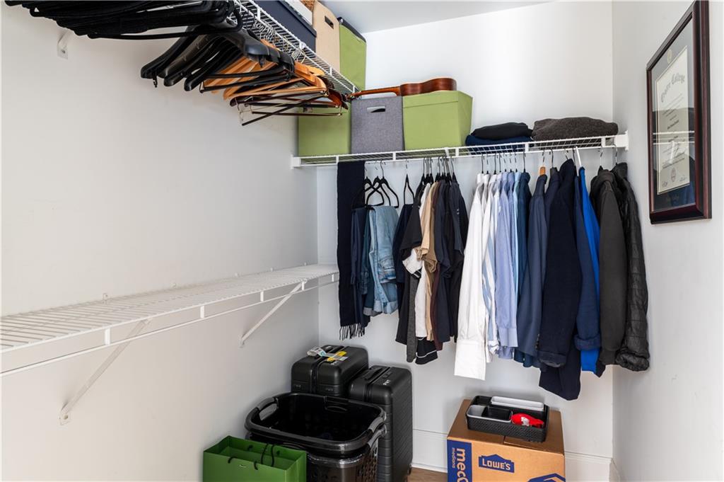 7 Chief Matthews Road, Unit 2B Decatur, GA 30030 - Photo 27 of 41 a view of walk in closet with clothes and shoes
