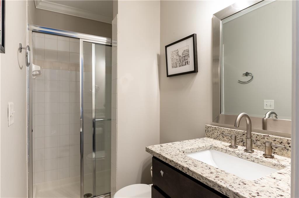 7 Chief Matthews Road, Unit 2B Decatur, GA 30030 - Photo 29 of 41 a bathroom with a granite countertop sink toilet and shower